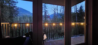 a window view of a porch with a view of a mountain at Casa del Rio - Peaceful River Guest Suite -Forests -Mountains -Hiking in Chilliwack