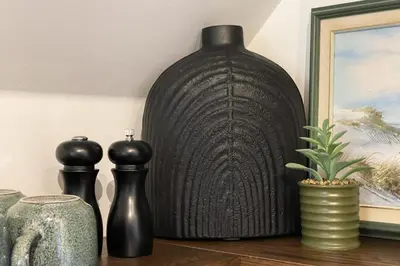 a large black vase sitting on top of a table at Raven Lady #201- Ucluelet Sleeps 6 Pet Friendly in Ucluelet
