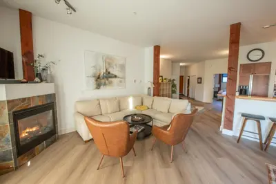 a living room with a couch and a fireplace at Big Beach Escape - Ucluelet - Sleeps 6 - Pet Friendly in Ucluelet