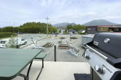 a view of a park with a table and a grill at Raven Lady #202- Ucluelet, Sleeps 4, Pet Friendly in Ucluelet