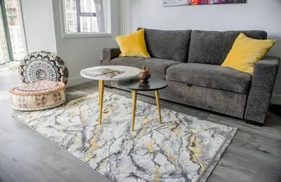 a living room with a couch and a table at Luxury Ocean view Apartment- Heart of Yaletown Downtown Vancouver in Vancouver