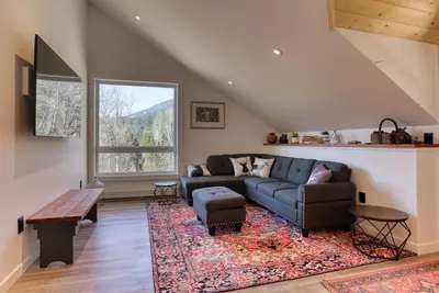 a living room with a couch and a table at 