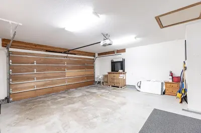 a garage with wooden sliding doors in a room at Premium 4-Bedroom Chalet in Whistler