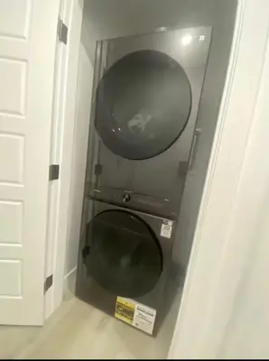 a bathroom with a black toilet in a room at Carrington Cozy Suite, Calgary in Calgary