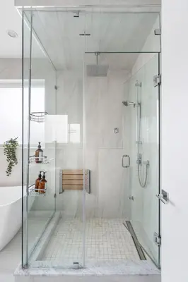 a shower with a glass door in a bathroom at Centrally Located Luxury Home with Views and Cinema in Vancouver