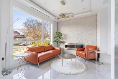 a living room with a couch and two chairs at Centrally Located Luxury Home with Views and Cinema in Vancouver