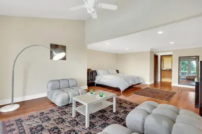 a living room with a couch and a bed at The West Vancouver Getaway Estate 5 Bedrooms in West Vancouver
