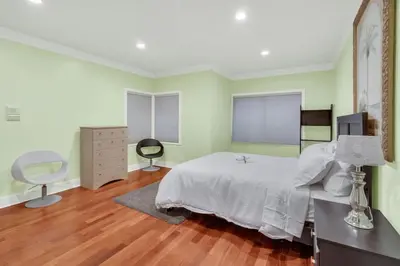 a bedroom with a bed and a desk and a chair at The West Vancouver Getaway Estate 5 Bedrooms in West Vancouver