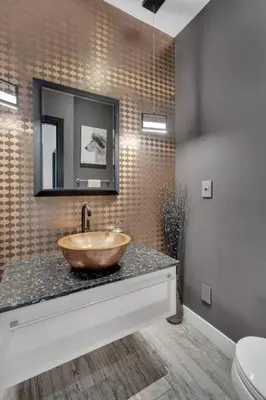a bathroom with a wooden bowl sink on a counter at The Sunset Lane Waterfront Home in West Vancouver