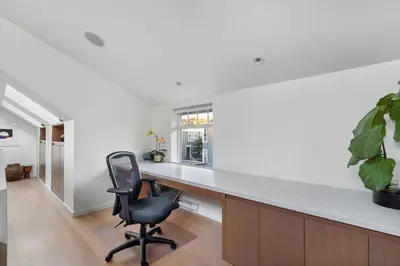 an office with a desk and a chair at Beautiful, Newly Renovated Creek Home in Vancouver
