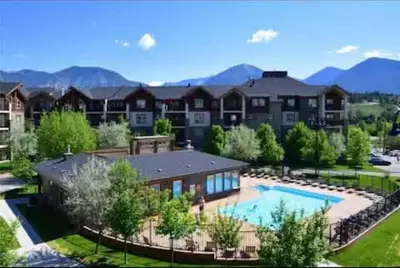 an aerial view of a home with a swimming pool at The Beach House Pool Access 5 Min Walk to Lake Sleeps 8 in Invermere