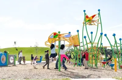 a group of people playing at a playground at Elegant & Cozy 2 Bdrm Basement suite near WEM in Edmonton