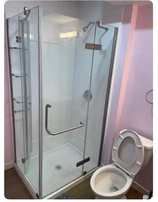 a bathroom with a shower and a toilet at Bedroom in Upland C in Edmonton