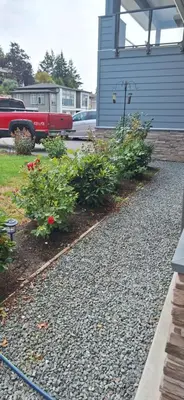 a row of plants in front of a house at Happy Zone Suite - Sleeps 4, Free Treats ! in Langford
