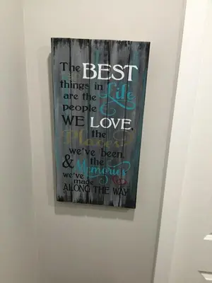 a painting hanging on a wall in a room at Almost Heaven - Cozy 2BDRM APT near Heritage Park,Spruce Meadows & Banff-SW Calgary in Calgary