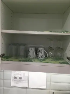 a shelf with jars and vases on it at Almost Heaven - Cozy 2BDRM APT near Heritage Park,Spruce Meadows & Banff-SW Calgary in Calgary