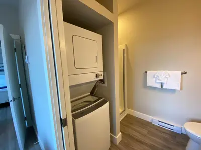 a small bathroom with a toilet and a sink at Haven On The Hill in Port Renfrew