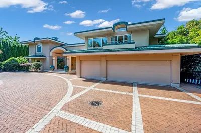 a house with a garage on a brick driveway at Spectacular, Water View House! Property overview! in West Vancouver