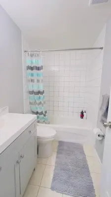 a bathroom with a toilet and a tub and a sink at Calgary Airport Stay Private Suite 1Bed in Calgary