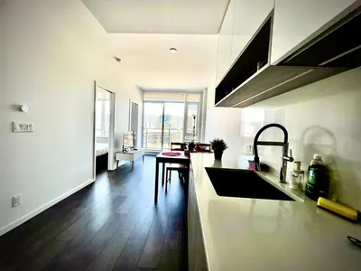 a kitchen with a sink and a counter top at Fashion 1B1B locates in the heart of Richmond in Richmond
