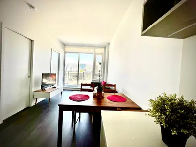 a room with a table with red mats on it at Fashion 1B1B locates in the heart of Richmond in Richmond