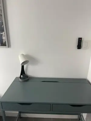 a desk with a lamp sitting on top of it at Lucy's House in Vancouver