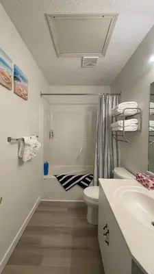 a bathroom with a toilet and a sink and a shower at Banff Boundary Lodge Mountain View 2Brms 3xAC Townhouse in Canmore