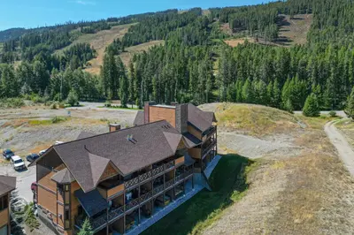 an aerial view of a building in the mountains at Timberstone Lodge by StayIn in Kimberley