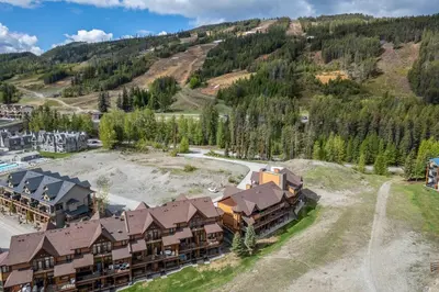 an aerial view of a resort with a mountain at Timberstone Lodge by StayIn in Kimberley