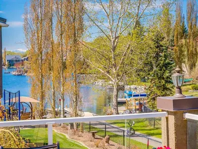a balcony with a view of a body of water at Calgary Lake House B&B in Calgary