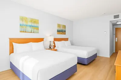 two beds in a hotel room with white walls at Chic Mountain Hideout in Canmore DT Near Banff! in Canmore