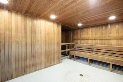 a sauna with wooden walls and wooden benches at Gorgeous Water View Unit in Downtown Vancouver in Vancouver