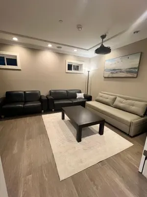 a living room with a couch and a coffee table at 3Bed 2Bath Steam Sauna Retreat! Family friendly! in Vancouver