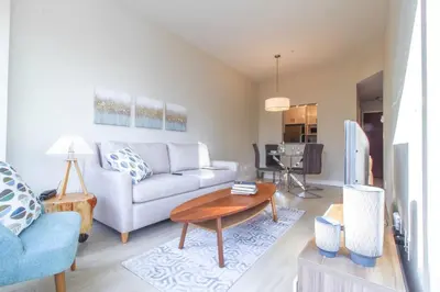 a living room with a couch and a table at Beautiful Downtown Unit in Vancouver