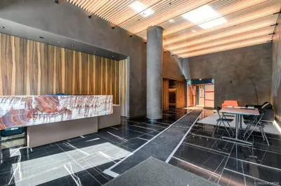 a room with a bed and a desk and a table at Brand New Luxury 1 bedroom Condo in Downtown Vancouver in Vancouver