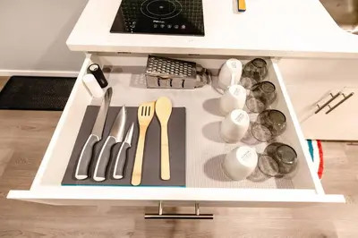 a drawer filled with utensils in a kitchen at Coliseum - Get Back to Nature in Nordegg