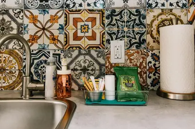 a kitchen counter with a sink and aaucet at Trailhead Tuck-Inn in Nordegg
