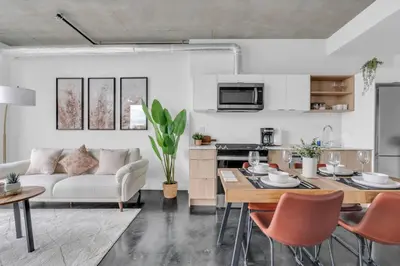 a living room with a couch and a table at Stylish Beltline 1BR w/ Parking in Calgary