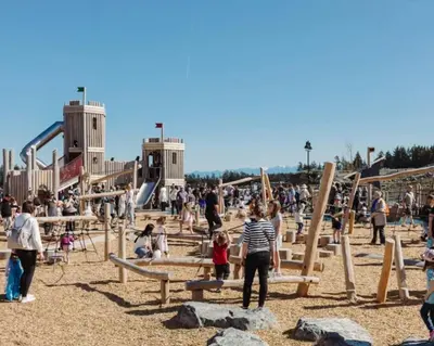 a group of people playing in a playground at Victoria's Family Oceanside Retreat, brand new 2br basement in Colwood