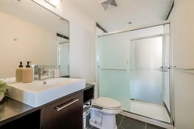 a bathroom with a sink and a shower at Gorgeous Unit with Beautiful City Views in Vancouver