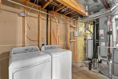 a laundry room with a washer and dryer in it at Acreage, 5 bdrm, King Bed, AC, Wood Fireplace, Rural in Balzac