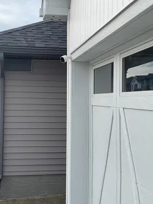 a white garage door with a window on a house at Comfy 2 Bedroom Suite Getaway in Edmonton