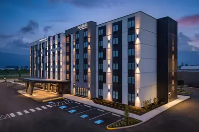 a rendering of a hotel building at night at Fairfield Inn & Suites by Marriott Chilliwack in Chilliwack
