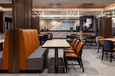 a restaurant with tables and chairs in a lobby at Fairfield Inn & Suites by Marriott Chilliwack in Chilliwack