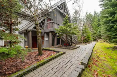 a brick walkway in front of a building at Arrowhead Point 2 by Outpost Whistler in Whistler