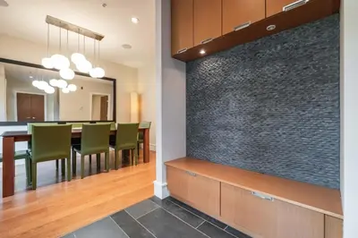 a dining room with a large wall at Fitzsimmons Walk 10 by Outpost Whistler in Whistler