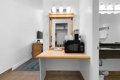 a room with a counter with a microwave on it at Kootenay Lakeview Resort BW Signature Collection in Balfour