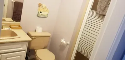 a small bathroom with a toilet and a sink at Silver Star Bed and Breakfast in Vernon