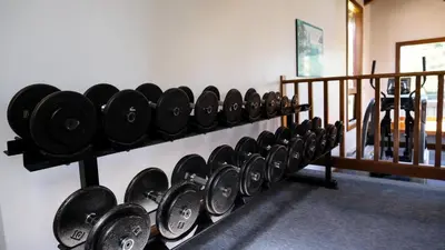 a row of dumbbells hanging on a wall at Painter's Lodge in Campbell River