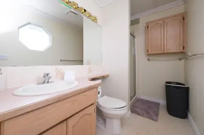 a bathroom with a sink and a toilet at Surrey Family Home w/ Patio & Garden – 3BR 2BA in Surrey